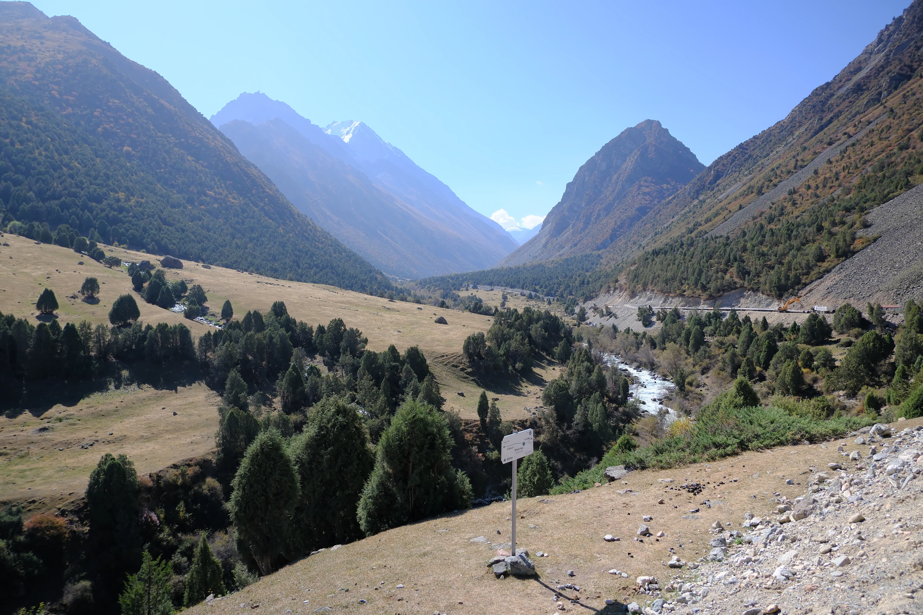 The river winding through the open upper valley of Alamedin Ravine.