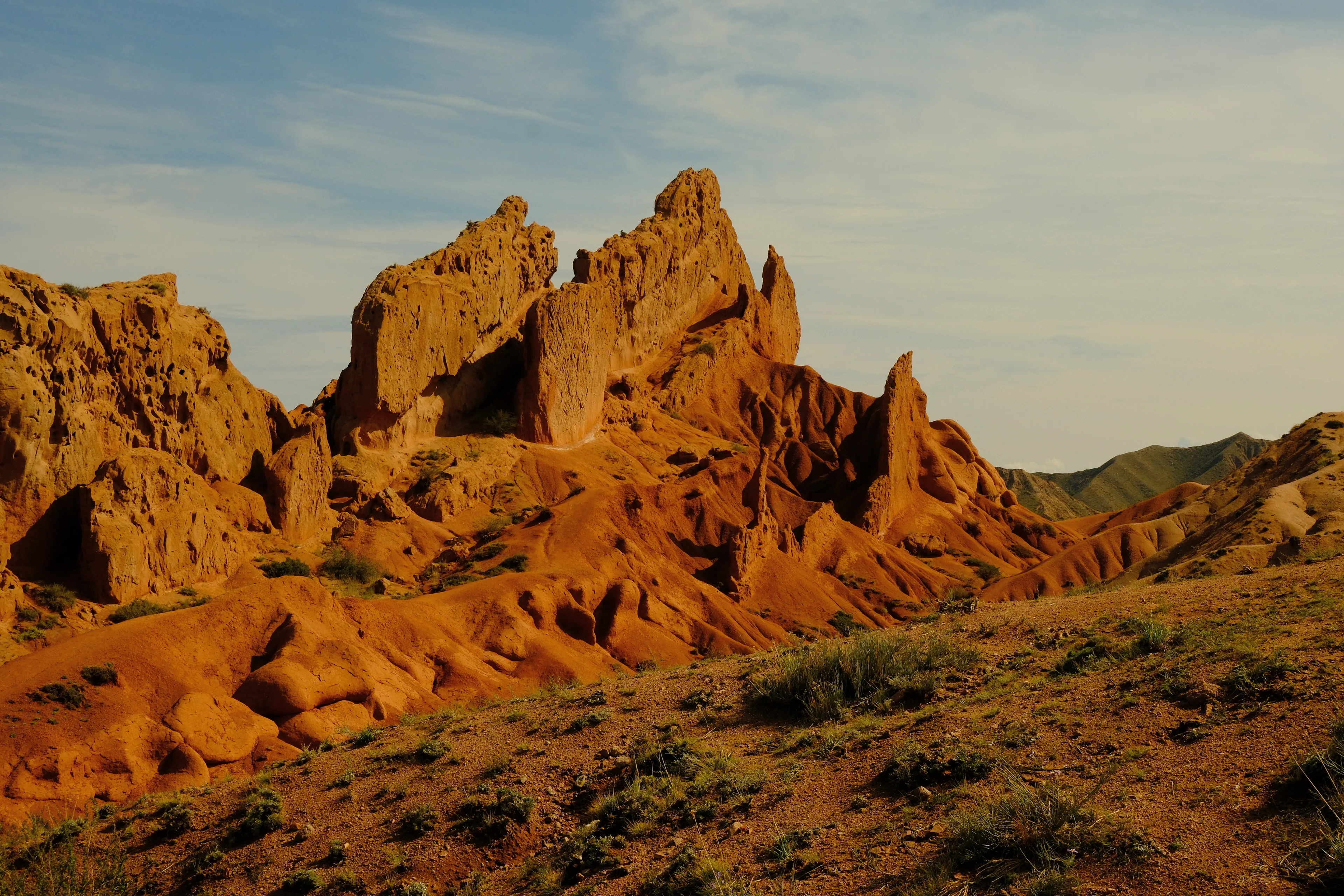 Sculpted orange sandstone in the warm light of Skazka Canyon
