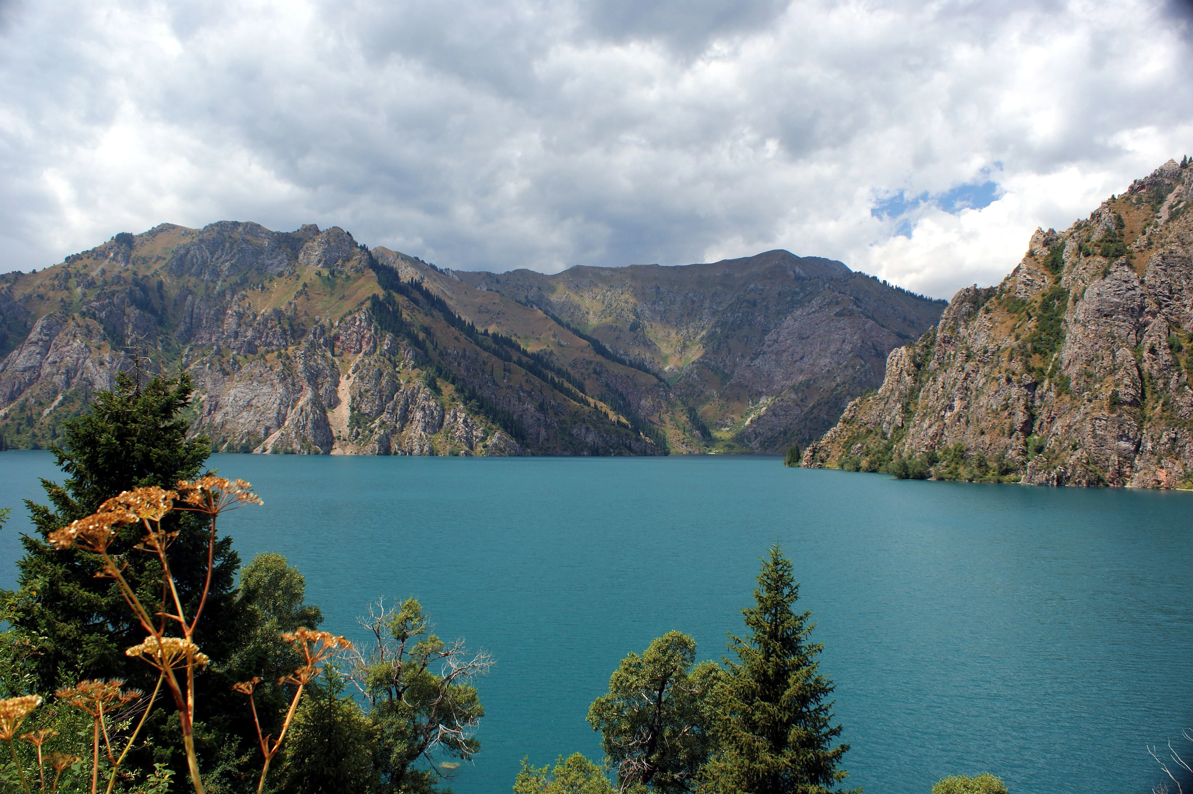 Sary-Chelek lake and the forested slopes of its nature reserve.